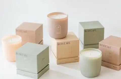 Bohemian candle collection in pastel shades with matte finish and minimalist packaging.