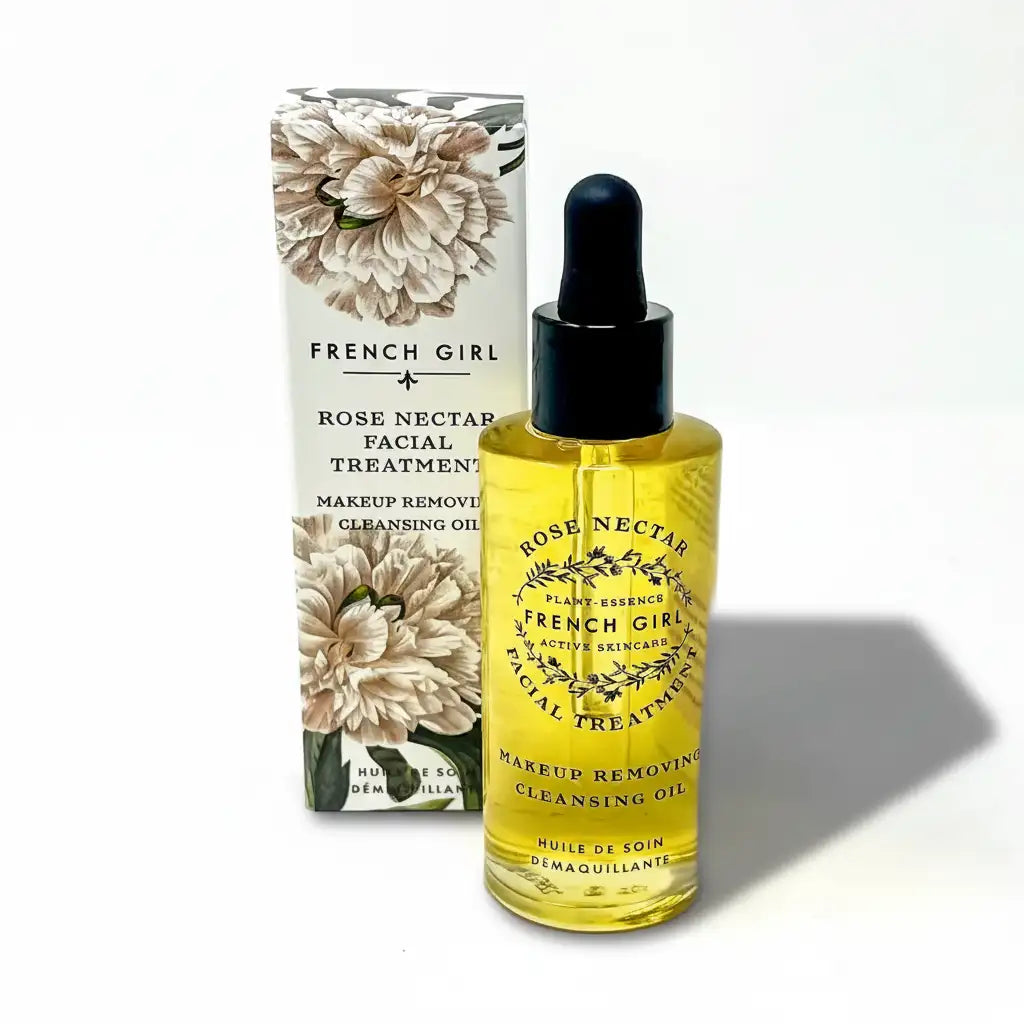A clear glass bottle with a black dropper cap, filled with golden-yellow liquid and labeled ’florale french girl botanical serum.’