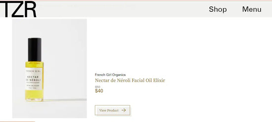 Facial oil in a glass bottle with a black cap.