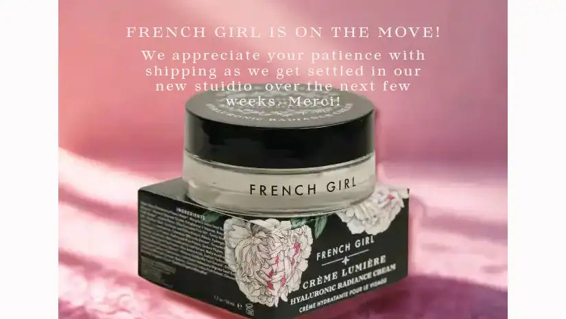 French girl crème lumière hyaluronic radiance cream in a sleek black jar with a matching lid, presented atop its ornate floral-patterned box.